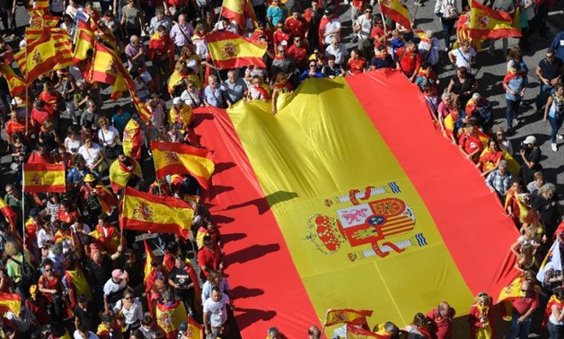 As the Catalan crisis foments following a vote Madrid regards as illegal, these anti-independence protesters in the breakaway region's main city Barcelona showed their feelings by holding aloft a giant Spanish flag to support national unity-AFP