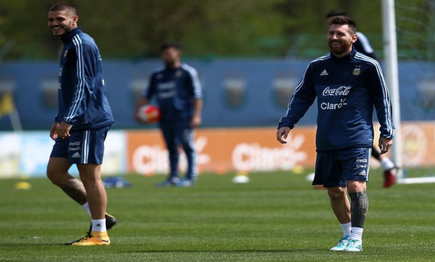 World Cup 2018 Qualifiers - South America - Argentina Training - Buenos Aires, Argentina - October 8, 2017 Argentina's Lionel Messi (R) smiles next to Mauro Icardi, during a training session ahead of their match against Ecuador. REUTERS/Agustin Marcarian