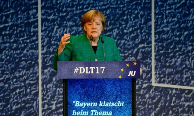  German Chancellor Angela Merkel delivers a speech during a congress of the Junge Union Deutschlands in Dresden, eastern Germany. Tobias Schwarz / AFP