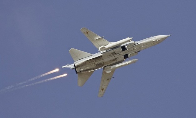A Sukhoi Su-24 jet fighter drops flares during a joint Kazakh-Russian military - Reuters 