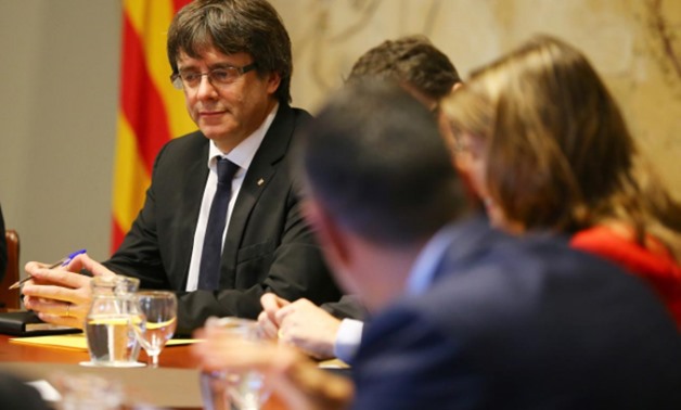 Catalan President Carles Puigdemont presides over a cabinet meeting at the regional government headquarters, the Generalitat, in Barcelona, Spain October 10, 2017. REUTERS/Ivan Alvarado