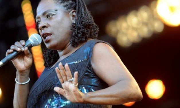 Sharon Jones, seen here performing in 2012, had her big break as a backup singer for Amy Winehouse - AFP