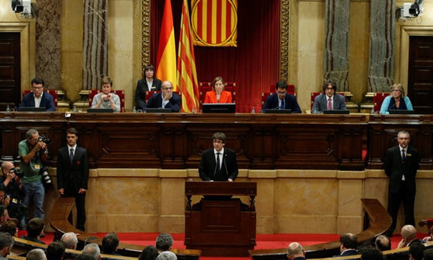 Catalan President Carles Puigdemont delivers a speech in the Catalan regional parliament in Barcelona, Spain, October 10, 2017. REUTERS