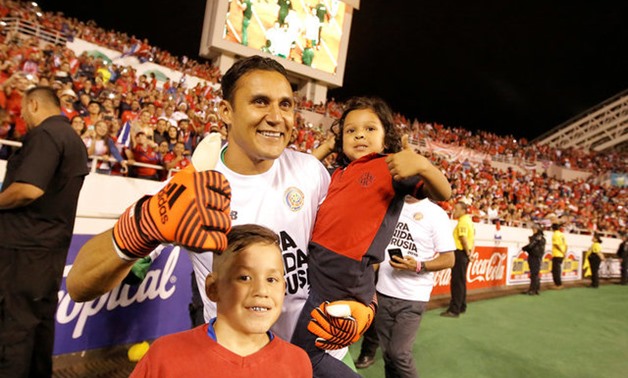  Keylor Navas of Costa Rica celebrates with his son after the game after qualifying for the 2018 World Cup. REUTERS