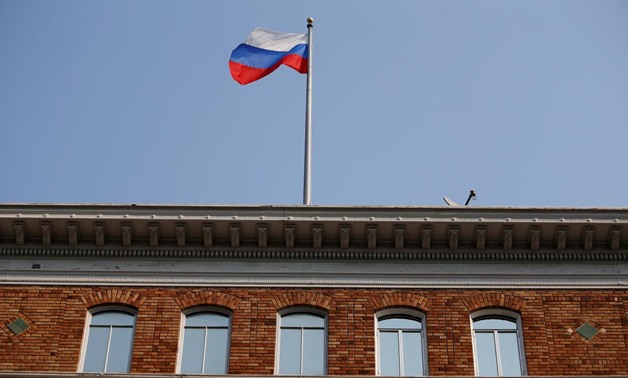 FILE- The Russian flag waves in the wind on the rooftop of the Consulate General of Russia in San Francisco, California, U.S., September 2, 2017. REUTERS