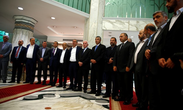 Hamas and Fatah delegations in Cairo announcing their agreement deal as part of reconciliation talks held under the auspices of Egypt Thursday, Oct.12, 2017 - Reuters