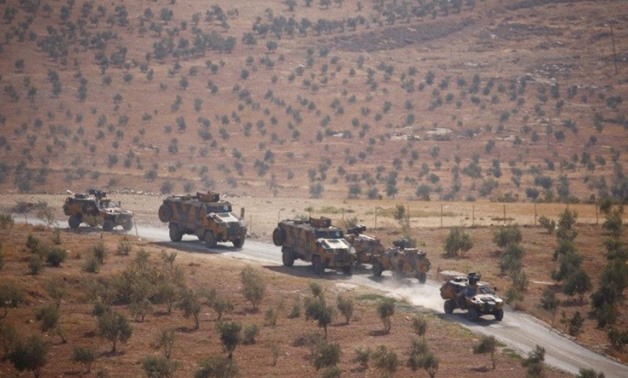Turkish armoured military vehicles patrol on the Turkish-Syrian border line in Reyhanli, Hatay province, Turkey, October 8, 2017. REUTERS/Osman Orsal