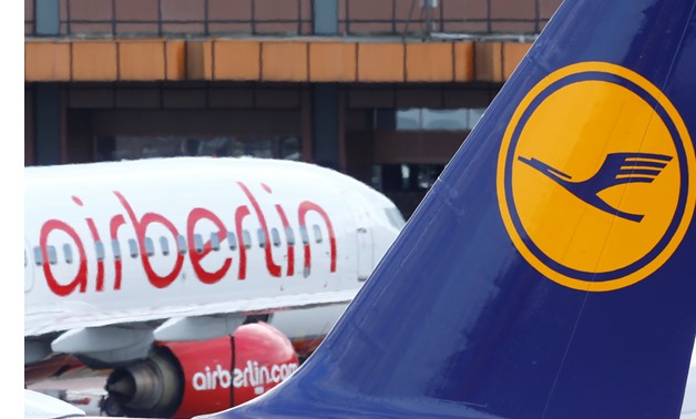 A Lufthansa airliner parks next to the Air Berlin aircraft at Tegel airport in Berlin, Germany, October 12, 2017. REUTERS/Hannibal Hanschke