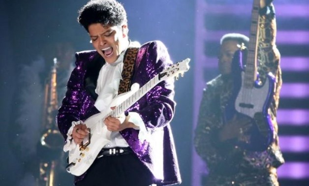 Bruno Mars performs "Let's Go Crazy" during a tribute to the late singer Prince at the 59th Annual Grammy Awards in Los Angeles - REUTERS