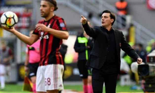 AC Milan's head coach Vincenzo Montella shouts instructions during their Italian Serie A match against Udinese, at the San Siro stadium in Milan - AFP