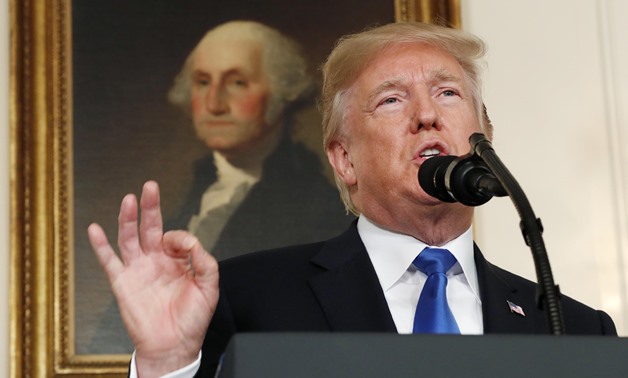 U.S. President Donald Trump speaks about Iran and the Iran nuclear deal in front of a portrait of President George Washington in the Diplomatic Room of the White House in Washington, U.S., October 13, 2017. REUTERS/Kevin Lamarque