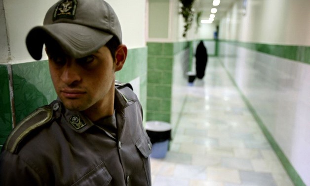 A prison guard stands along a corridor in Tehran's Evin prison June 13, 2006. . (photo credit:REUTERS)