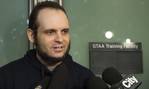Joshua Boyle speaks to the media after arriving at the Pearson International Airport -AFP
