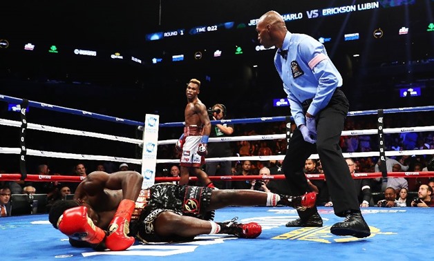 Jermell Charlo knocks out Erickson Lubin in the first round during their WBC Junior Middleweight Title bout, at Barclays Center of Brooklyn, in New York, on October 14, 2017 (AFP Photo/AL BELLO)