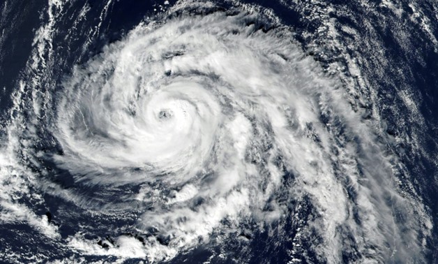 his handout satellite image released by NASA Earth Observatory shows hurricane Ophelia approaching the Azores