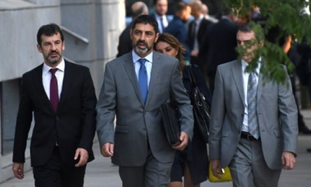 Josep Luis Trapero (C), the chief of Catalonia's regional police force, faces up to 15 years in jail if found guilty of sedition