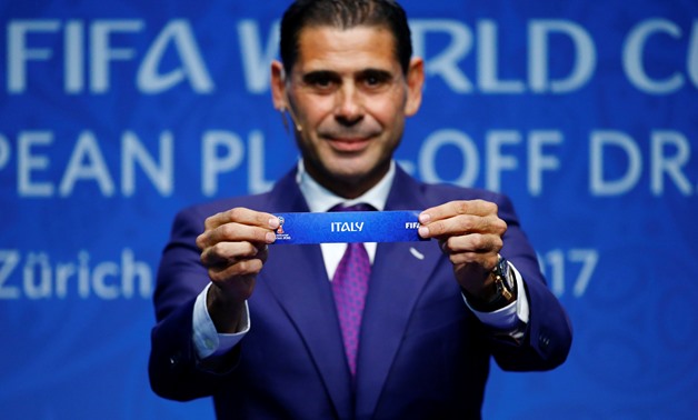Fernando Hierro displays the name 'Italy' during the draw - Press image courtesy Reuters