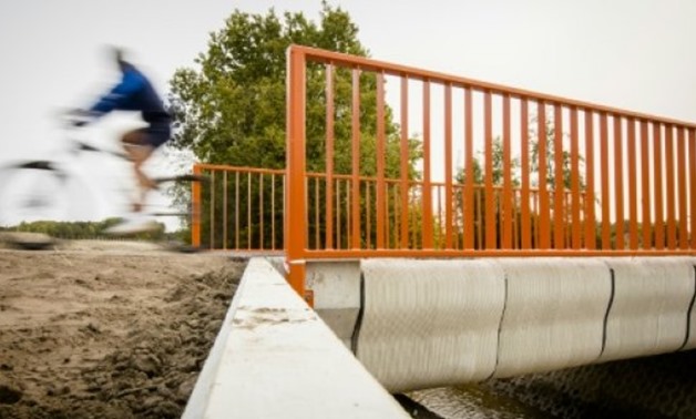 A 3D printer laid some 800 layers of concrete to create the eight-metre bicycle bridge in the Dutch town of Gemert