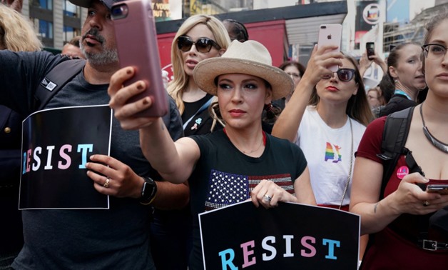 Actress Alyssa Milano attends a protest in Times Square, New York City, New York, U.S., July 26, 2017 – REUTERS