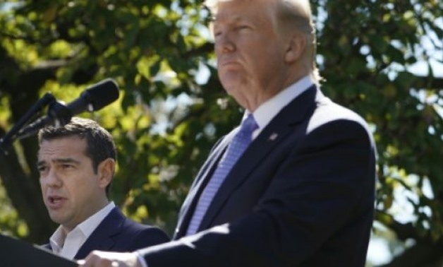 US President Donald Trump listens to a reporter's question during a joint press conference with Greek Prime Minister Alexis Tsipras in the Rose Garden of the White House on October 17, 2017 in Washington, DC - AFP