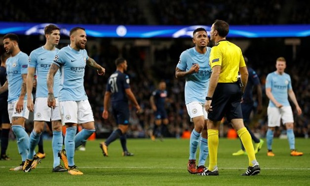 Manchester City's Gabriel Jesus and team mates speak to referee Antonio Miguel Mateu Lahoz REUTERS