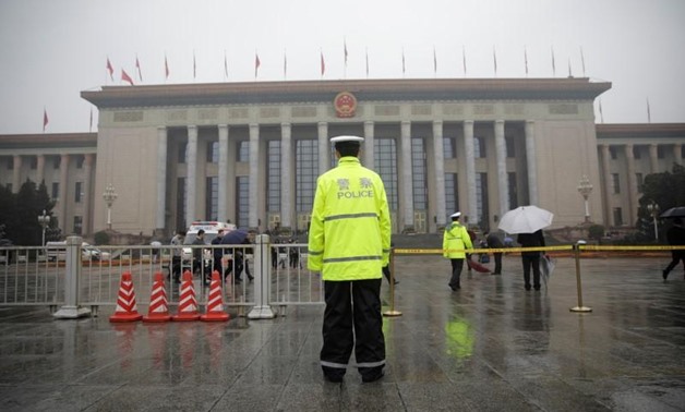 A policeman stands guard outside the Great Hall of the People during the opening of the 19th National Congress of the Communist Party of China in Beijing, China October 18, 2017. REUTERS/Ahmad Masood