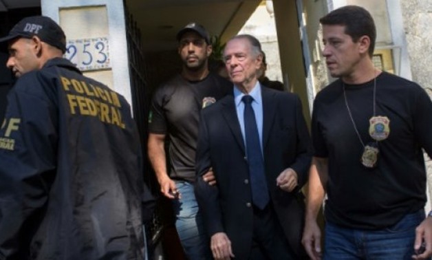Brazilian police on October 5 arrested Brazil's Olympic Committee chief Carlos Nuzman (C) as part of a probe into alleged buying of votes to secure Rio's hosting of the 2016 Games - AFP/File