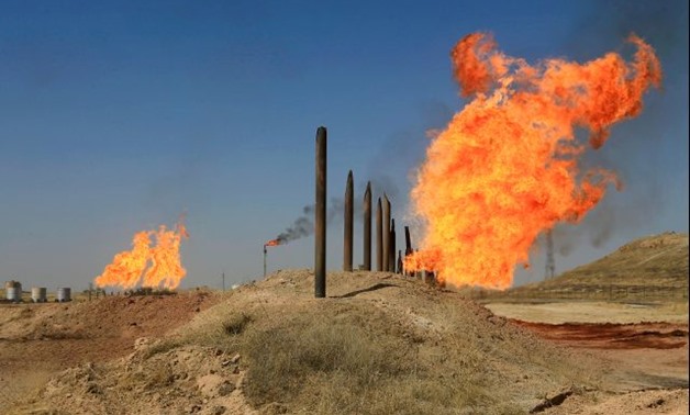 Flames emerge from flare stacks at the oil fields in Kirkuk -- REUTERS