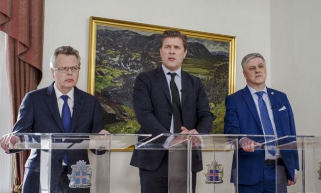 Iceland's Central Bank governor Mar Gudmundsson (L to R), Prime Minister Bjarni Benediktsson, Finance minister Benedikt Johannesson attend a news conference in Reykjavik, Iceland, March 12, 2017. REUTERS
