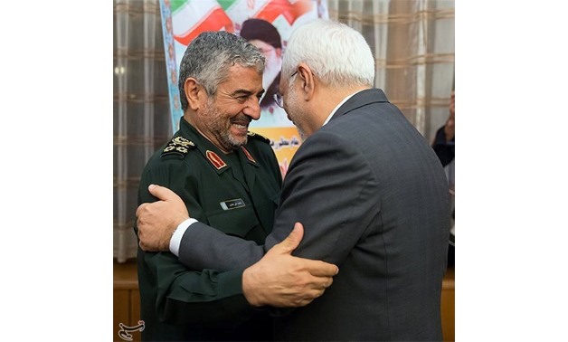 IRGC commander Jafari hugs Iran's FM Zarif during meeting for the 40th anniversary of the Islamic Revolution, in Tehran -- REUTERS