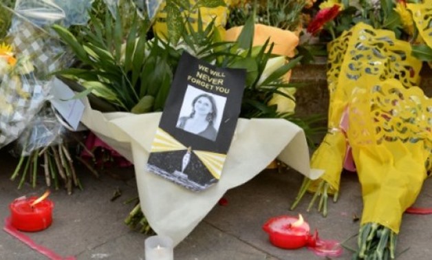 AFP / by Robin MILLARD | Flowers were placed at the Great Siege monument in Valletta, Malta, on Thursday as a tribute to the murdered investigative journalist Daphne Caruana Galizia and tributes lay at the foot of the Great Siege monument in Valletta, Mal