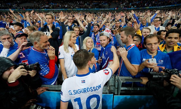 Gylfi Sigurdsson celebrate with the Icelandic fans, Reuters