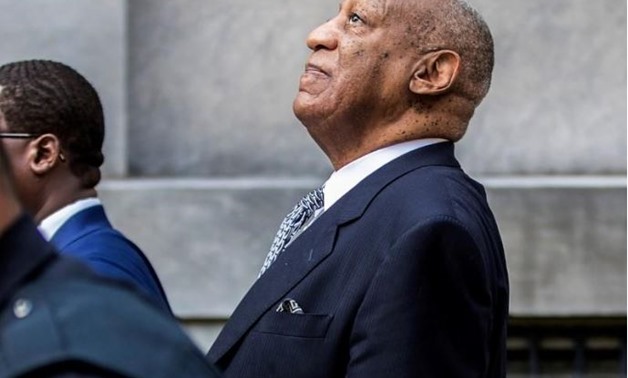Bill Cosby leans back to listens to words of encouragement from onlookers outside Montgomery County Courthouse in Norristown, Pennsylvania., August 2017. REUTERS/Michael Bryant