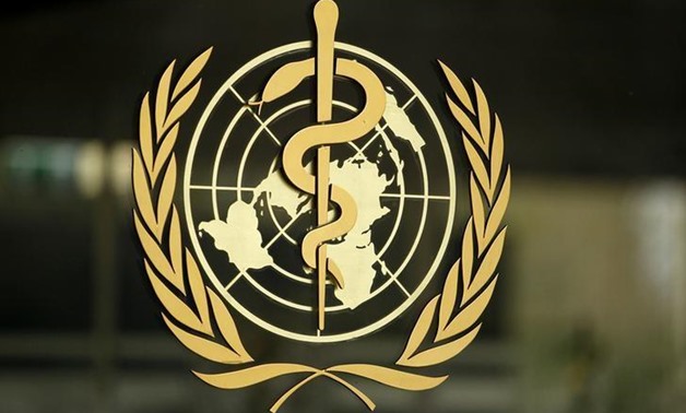 The World Health Organization (WHO) logo is pictured at the entrance of its headquarters in Geneva, January 25, 2015. REUTERS/Pierre Albouy
