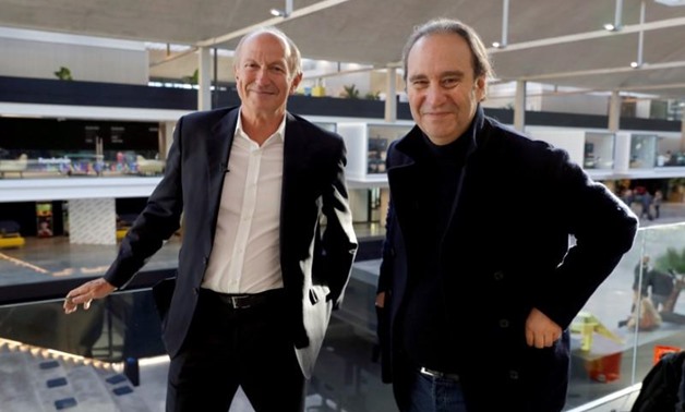Founder of French broadband Internet provider Iliad Xavier Niel and Jean-Paul Agon, Chairman and Chief Executive Officer of cosmetics company L'Oreal, pose after a news conference at the startup incubator "Station F" in Paris, France, October 20, 2017. RE