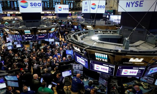 Traders gather for the IPO of Singapore-based Sea Limited on the floor of the New York Stock Exchange (NYSE) in New York, U.S., October 20, 2017. REUTERS/Brendan McDermid