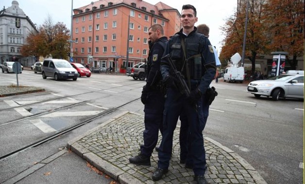 German police officers guard the site where earlier a man injured several people in a knife attack in Munich, Germany, October 21, 2017.