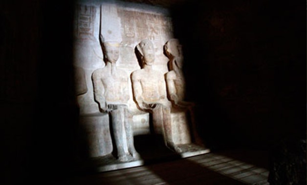 Dawn light shines on the statues of Pharaoh Ramses II (R) and Amun, the god of light (L), in the inner sanctum of the Abu Simbel temple in Aswan, Egypt, Feb. 22, 2014. Reuters/Mohamed Abdel Ghany