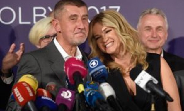 Czech billionaire Andrej Babis (L), chairman of the ANO movement (YES) and his wife Monika smile at ANO headquarter after Czech elections on October 21, 2017 in Prague - AFP