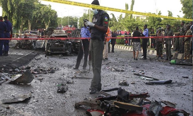 Suicide bomber kills 13 others in northeast Nigerian city - Press Photo