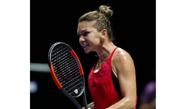 Romania's Simona Halep celebrates during her group stage match with France's Caroline Garcia – Press image courtesy Reuters