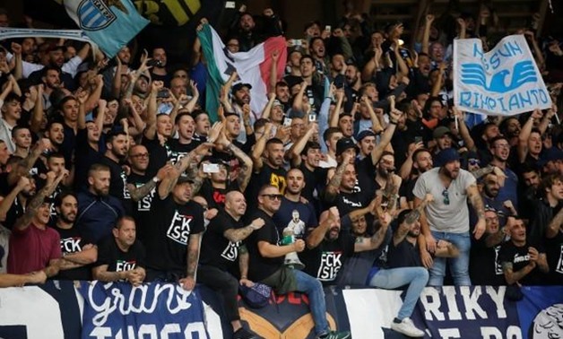 Lazio fans celebrate at the end of the match REUTERS/Jean-Paul Pelissier
