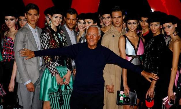 Italian designer Giorgio Armani acknowledges applause at the end of his Spring/Summer 2018 show at the Milan Fashion Week in Milan, Italy, September 22, 2017. REUTERS/Stefano Rellandini