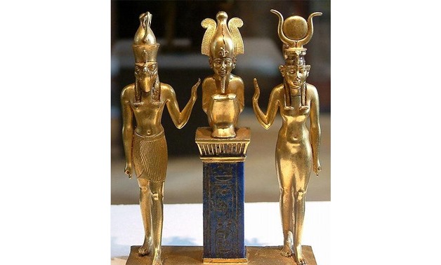 Golden Egyptian statues exhibited at Louvre Museum in Paris - File Photo