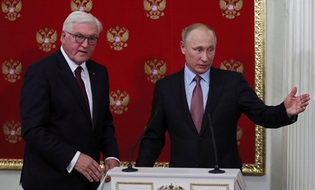 Russian President Vladimir Putin and German President Frank Walter Steinmeier attend a joint news conference following their meeting at the Kremlin in Moscow, Russia October 25, 2017 - REUTERS