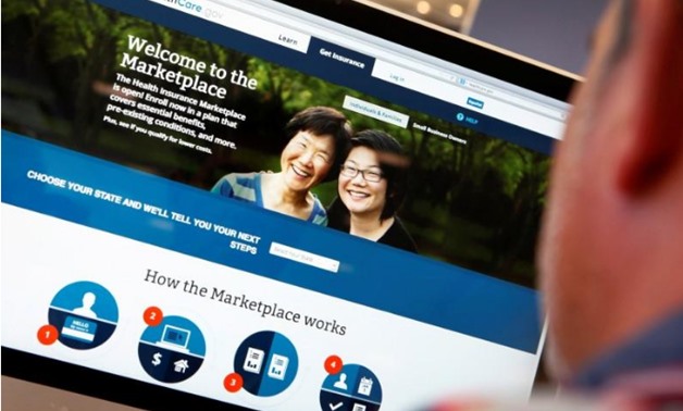  A man looks over the Affordable Care Act (commonly known as Obamacare) signup page on the HealthCare.gov website in New York in this October 2, 2013 photo illustration - REUTERS/Mike Segar/File Photo