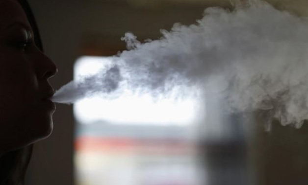  A woman exhales vapor from an electronic cigarette at The Vapor Spot vapor bar in Los Angeles, California -  REUTERS/Mario Anzuoni