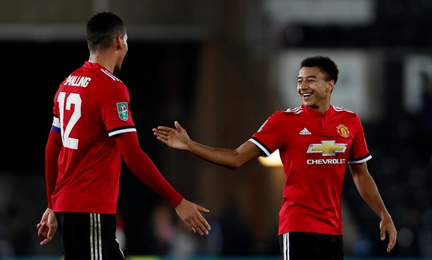 Manchester United's Jesse Lingard celebrates after the match with Chris Smalling – Press image courtesy Reuters