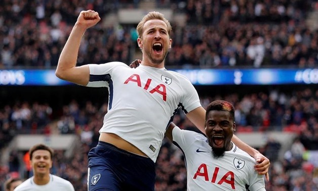 Tottenham's Harry Kane celebrates scoring their first goal with Serge Aurier. REUTERS/Eddie Keogh