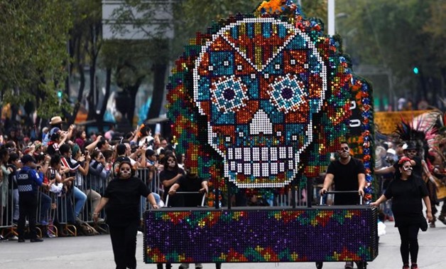 A float with a skull figure participates in a procession to commemorate Day of the Dead in Mexico City, Mexico -  REUTERS/Edgard Garrido
